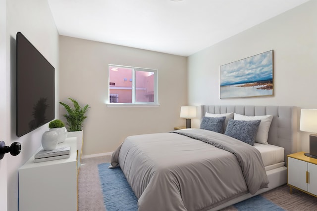 carpeted bedroom with baseboards