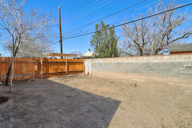 view of yard with a fenced backyard