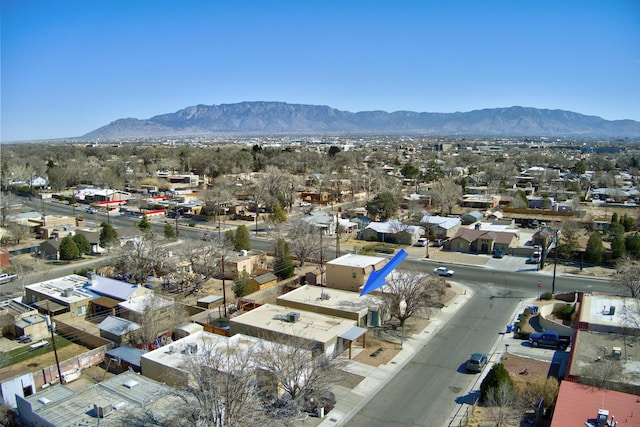 birds eye view of property featuring a mountain view