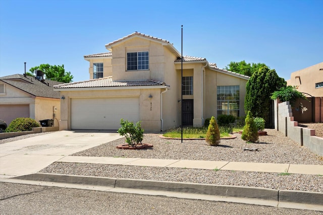 view of front of house featuring stucco siding, driveway, cooling unit, an attached garage, and a tiled roof