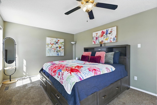 bedroom with a ceiling fan, carpet floors, baseboards, and visible vents