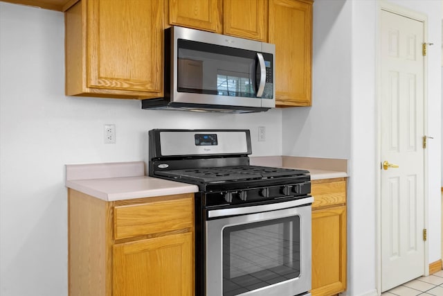 kitchen featuring light countertops and appliances with stainless steel finishes