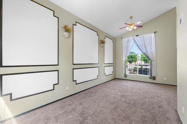 spare room with visible vents, a ceiling fan, lofted ceiling, and carpet floors