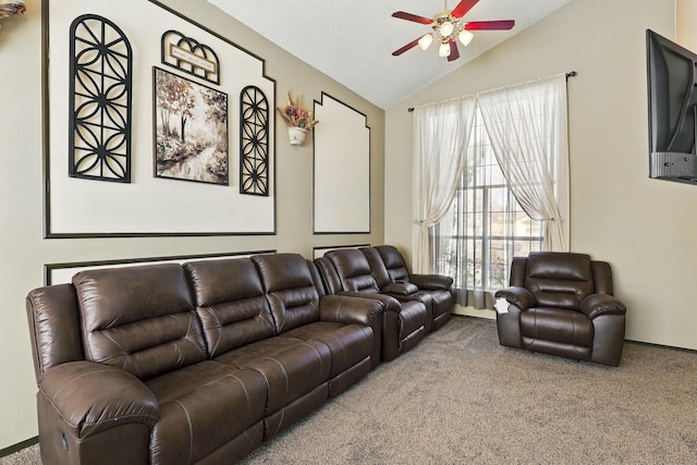 carpeted living room with vaulted ceiling and a ceiling fan