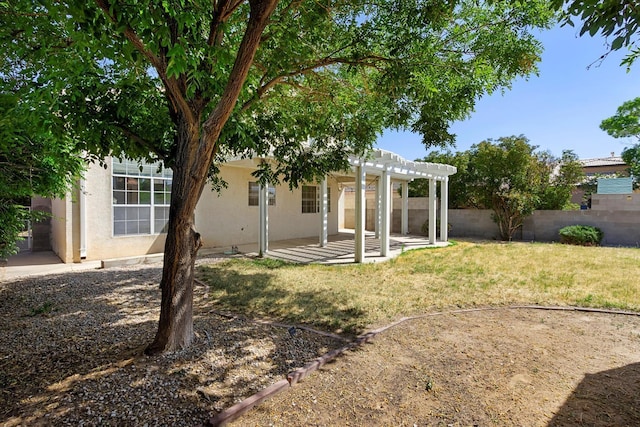 view of yard with a patio area, fence, and a pergola