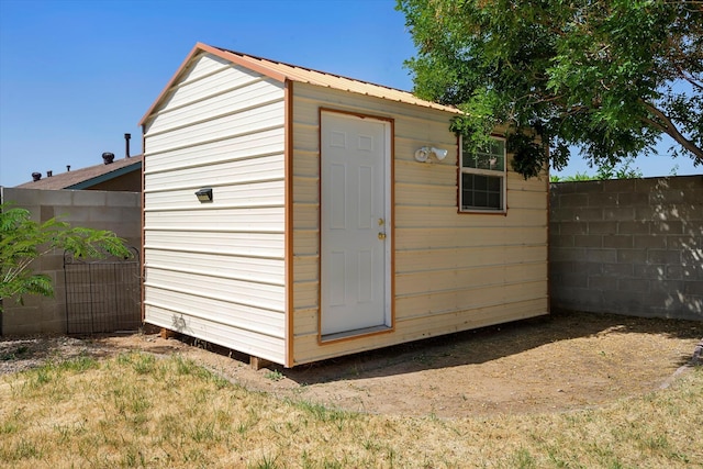 view of shed featuring a fenced backyard