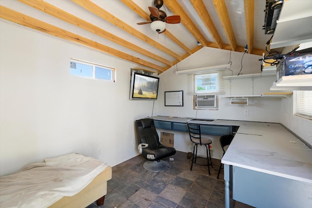 office area featuring cooling unit, a ceiling fan, vaulted ceiling with beams, and stone finish floor