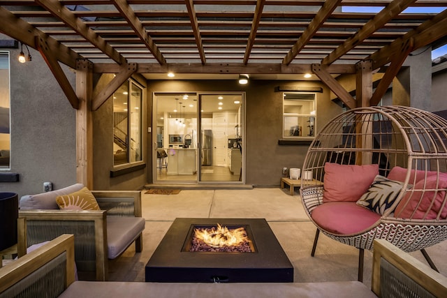 view of patio / terrace with an outdoor living space with a fire pit and a pergola