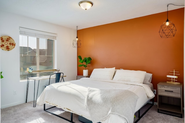 carpeted bedroom featuring baseboards