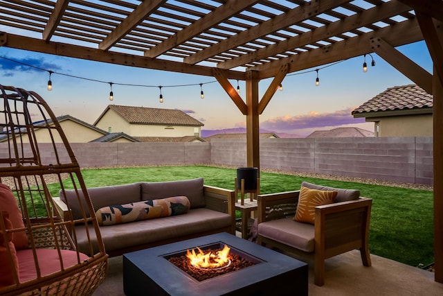 view of patio / terrace with a fenced backyard and an outdoor living space with a fire pit