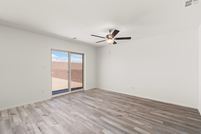 empty room with ceiling fan, baseboards, visible vents, and light wood-type flooring