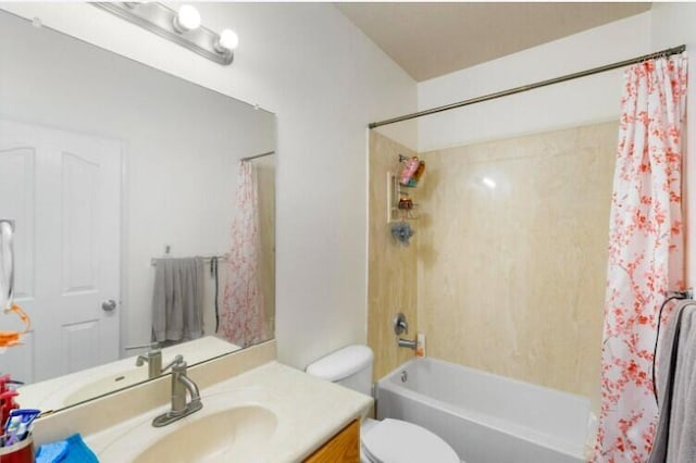 bathroom featuring toilet, shower / tub combo with curtain, and vanity