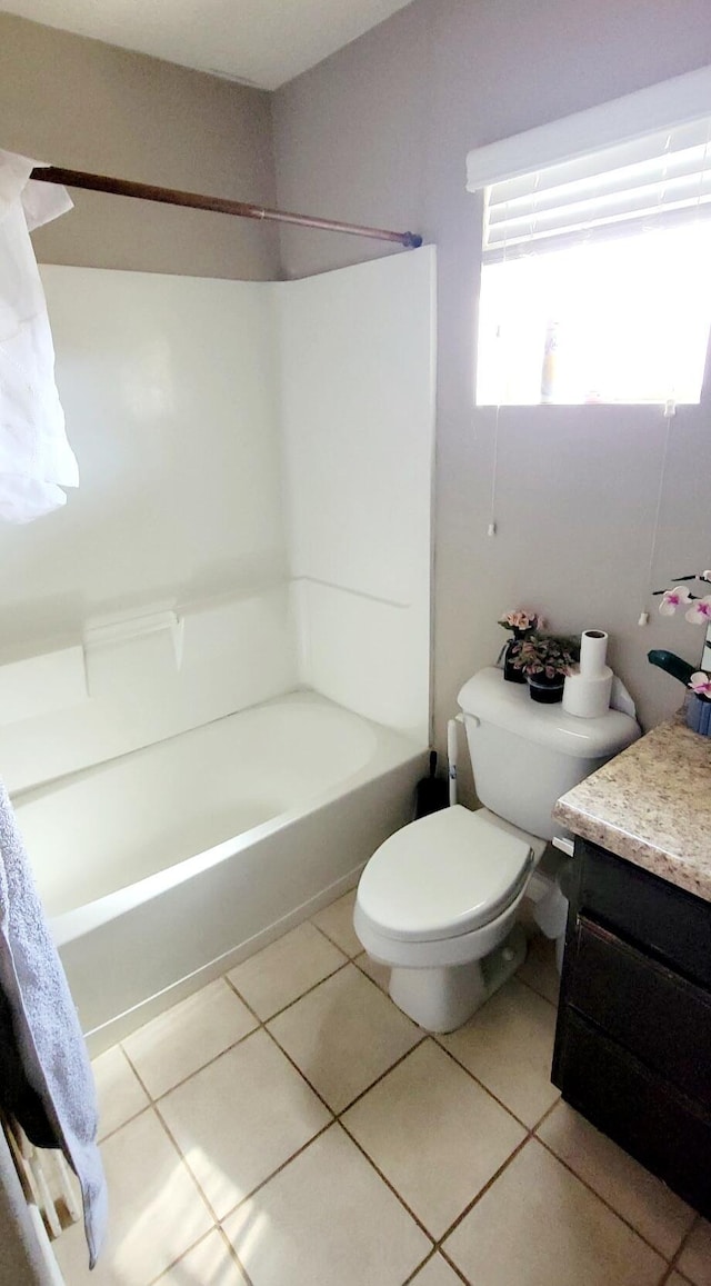 full bath featuring vanity, toilet, bathing tub / shower combination, and tile patterned flooring