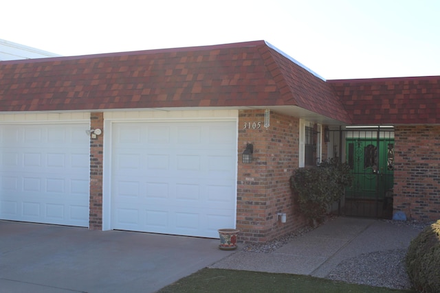 garage with concrete driveway