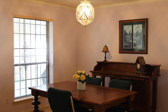 dining space featuring ornamental molding