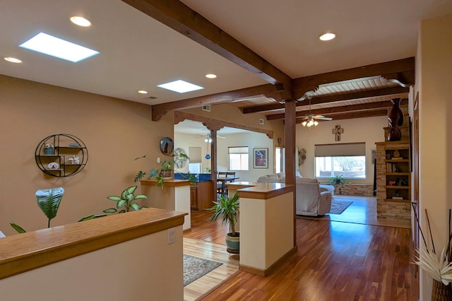 kitchen featuring a ceiling fan, beam ceiling, recessed lighting, and light wood-style floors