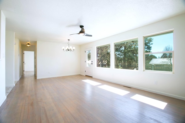 spare room with visible vents, baseboards, and light wood-style floors