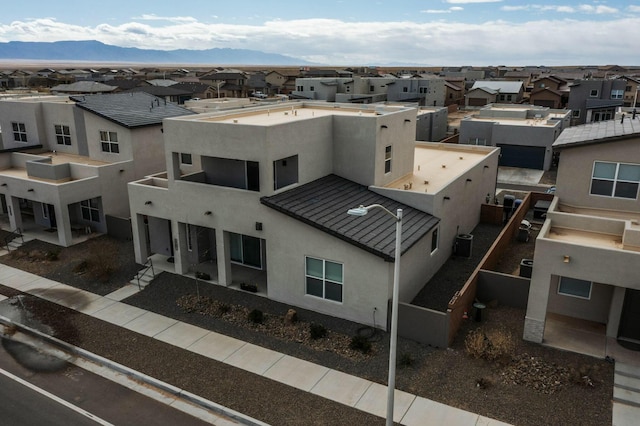 drone / aerial view with a mountain view and a residential view