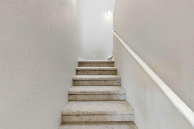 stairs with a textured wall