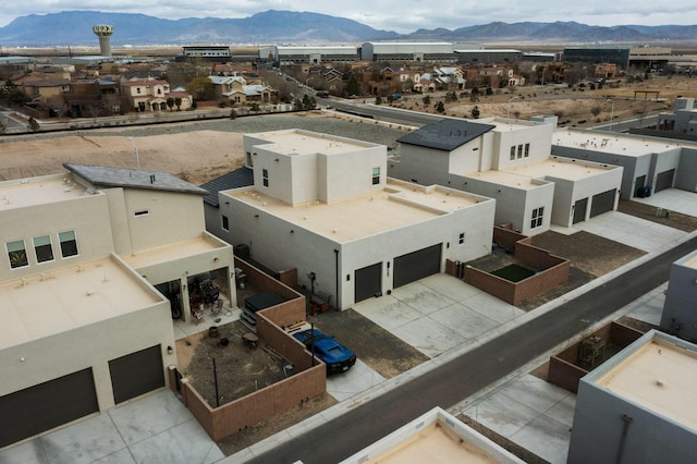 birds eye view of property with a mountain view