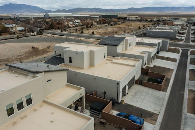 birds eye view of property with a mountain view