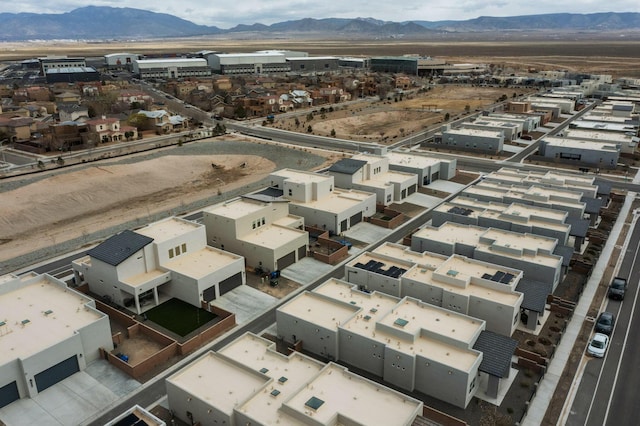 birds eye view of property featuring a mountain view