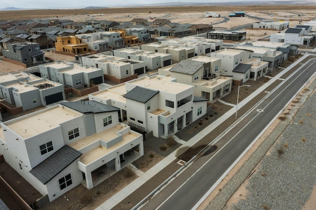 birds eye view of property with a residential view