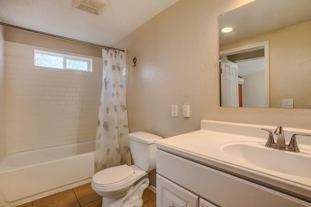 full bath featuring tile patterned flooring, toilet, shower / tub combo, visible vents, and vanity