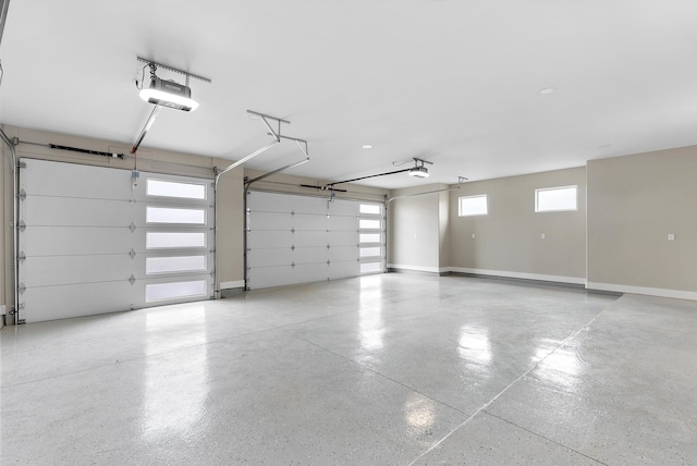 garage featuring baseboards and a garage door opener