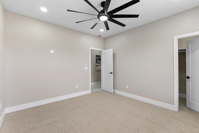 unfurnished bedroom with recessed lighting, light carpet, ceiling fan, and baseboards