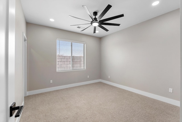 carpeted spare room with visible vents, baseboards, a ceiling fan, and recessed lighting