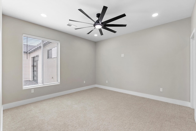 carpeted empty room with a ceiling fan, recessed lighting, visible vents, and baseboards