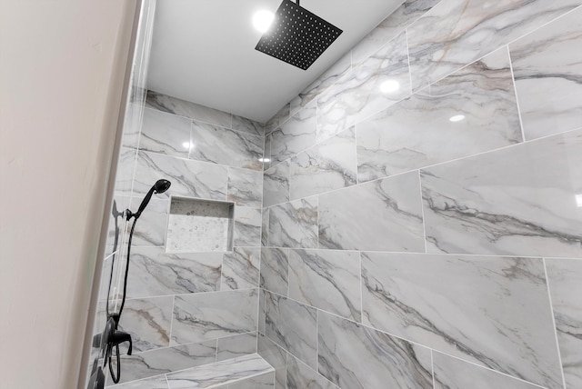 bathroom featuring a tile shower