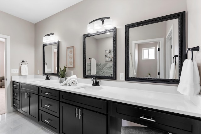 full bathroom with a sink and double vanity