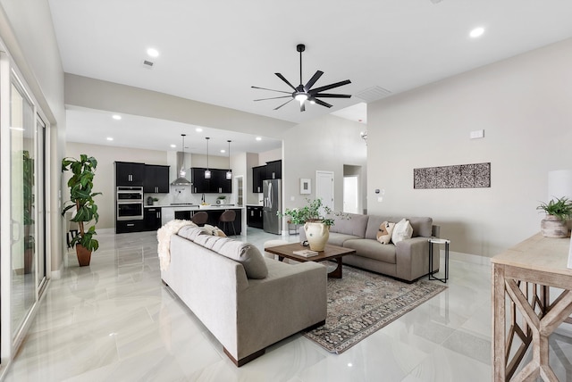 living room with visible vents, marble finish floor, a ceiling fan, and recessed lighting