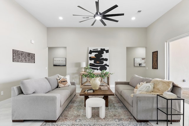 living room with baseboards, visible vents, a ceiling fan, and recessed lighting