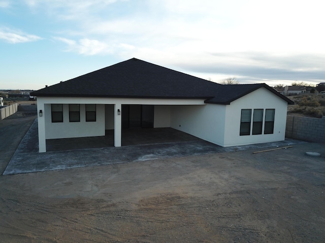 view of front of property featuring fence