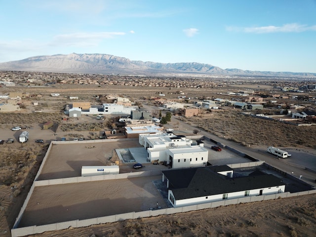 birds eye view of property featuring a mountain view