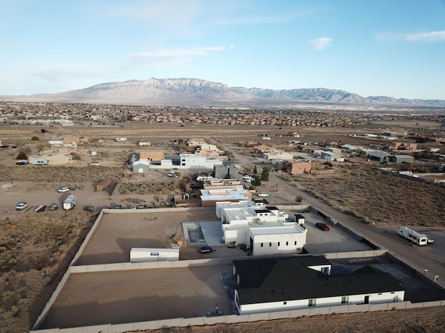 birds eye view of property with a desert view and a mountain view