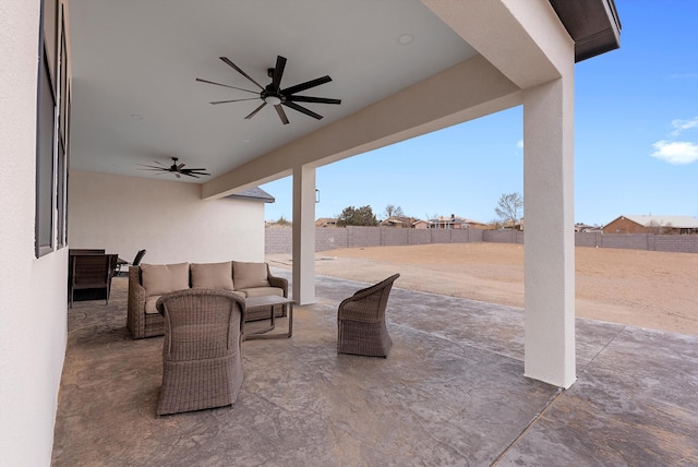 view of patio featuring a fenced backyard, ceiling fan, and outdoor lounge area