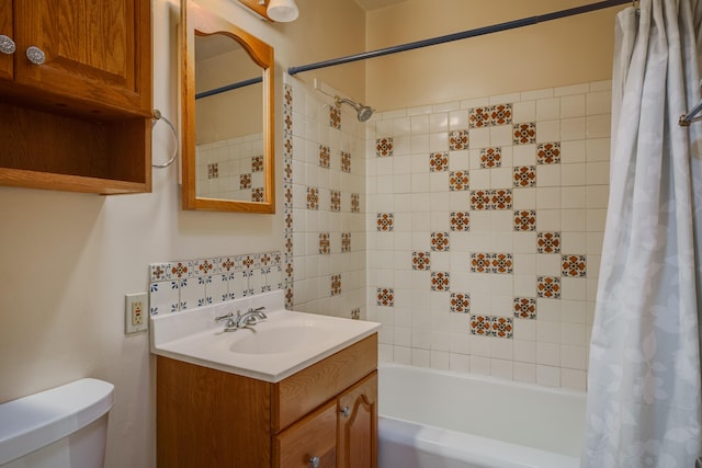 full bathroom featuring vanity, toilet, and shower / bathtub combination with curtain