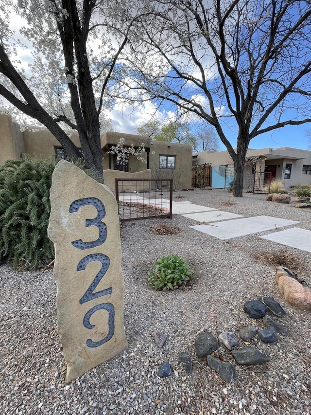 exterior space featuring a gate and fence