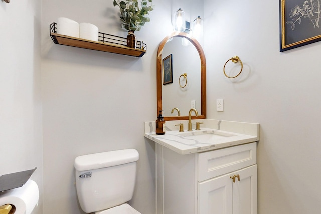 half bath with vanity and toilet