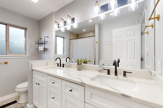 full bath with toilet, visible vents, a sink, and tile patterned floors