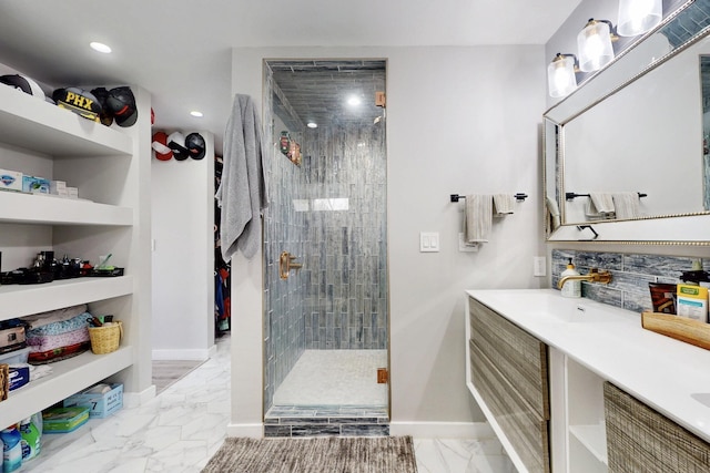 bathroom featuring a stall shower, baseboards, marble finish floor, vanity, and recessed lighting