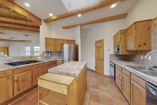 kitchen featuring tile countertops, black appliances, a kitchen island, and a sink