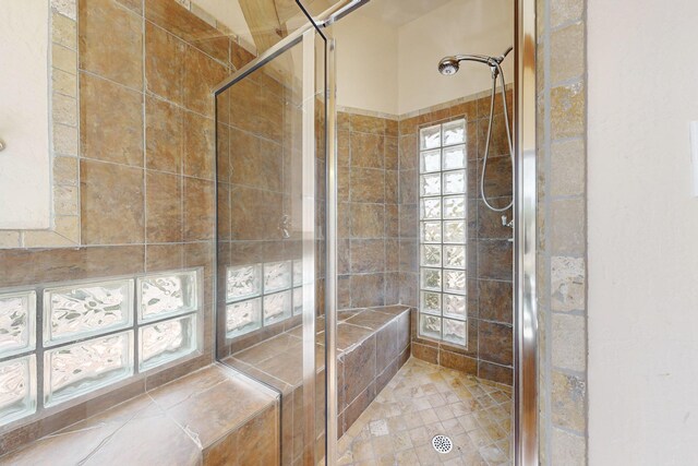 bathroom featuring a shower stall