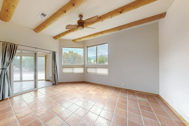 unfurnished room with light tile patterned floors, beam ceiling, plenty of natural light, and visible vents