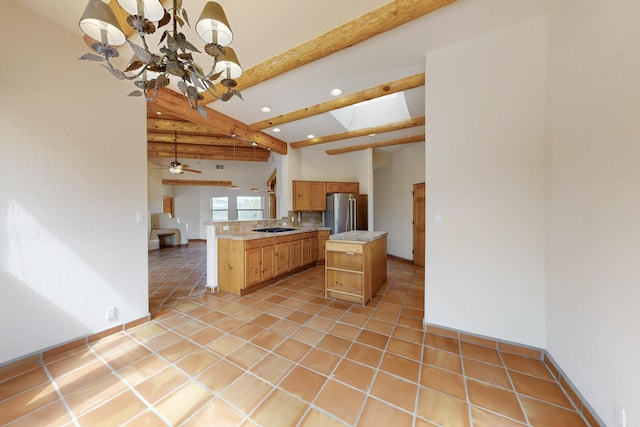 kitchen featuring light tile patterned floors, recessed lighting, light countertops, a chandelier, and high end refrigerator