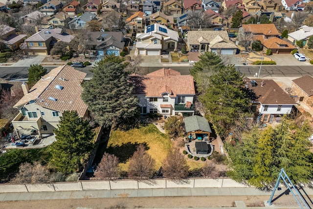 birds eye view of property with a residential view